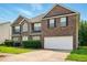 Beautiful two-story brick home with a well-manicured lawn and a two-car garage at 3731 Laramie Rd, Ellenwood, GA 30294