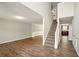 Bright foyer with high ceilings, wood flooring, and a staircase leading to the second floor at 3731 Laramie Rd, Ellenwood, GA 30294