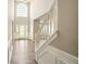 Grand two-story foyer with an arched window and staircase at 3731 Laramie Rd, Ellenwood, GA 30294