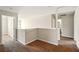 Second-floor hallway with carpeted floors and views to other rooms at 3731 Laramie Rd, Ellenwood, GA 30294