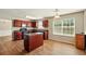 Kitchen featuring wood cabinets, laminate floors, and a view of a kitchen island at 3731 Laramie Rd, Ellenwood, GA 30294