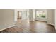 Open floor plan featuring wood-look flooring and neutral paint at 3731 Laramie Rd, Ellenwood, GA 30294