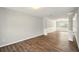 Living room featuring wood-look flooring and white trim at 3731 Laramie Rd, Ellenwood, GA 30294