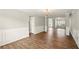 Living room featuring an open concept, wood-look floors, and neutral paint at 3731 Laramie Rd, Ellenwood, GA 30294
