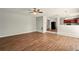 Open-concept living room with hardwood floors and a ceiling fan at 3731 Laramie Rd, Ellenwood, GA 30294