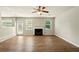 Spacious living room featuring a fireplace, hardwood floors, and natural light at 3731 Laramie Rd, Ellenwood, GA 30294