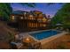 Backyard pool and patio with a fire pit, lounge chairs, and a multi-level deck at 5705 Registry Oaks Se Ln, Mableton, GA 30126
