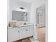 Bathroom featuring a white vanity with a sleek mirror and modern fixtures at 5705 Registry Oaks Se Ln, Mableton, GA 30126