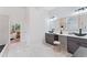 Beautiful bathroom with dual sinks, vessel faucets, and an open design leading into the main bedroom at 5705 Registry Oaks Se Ln, Mableton, GA 30126