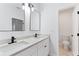 Bathroom with dual sinks, granite countertops, and modern fixtures at 5705 Registry Oaks Se Ln, Mableton, GA 30126