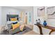 King size bed with hardwood floors and a view of the bathroom with decor makes for a homey feeling at 5705 Registry Oaks Se Ln, Mableton, GA 30126