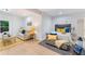 Open bedroom and living room with a couch, king size bed, and natural lighting making it warm and inviting at 5705 Registry Oaks Se Ln, Mableton, GA 30126