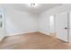 Bedroom with hardwood floors, neutral walls, and a bright window at 5705 Registry Oaks Se Ln, Mableton, GA 30126