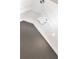 Close-up of a modern chandelier that provides the illumination for a living space with tall ceilings at 5705 Registry Oaks Se Ln, Mableton, GA 30126