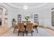 Elegant dining room featuring a modern chandelier, stylish furniture, and tasteful decor at 5705 Registry Oaks Se Ln, Mableton, GA 30126