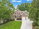 Charming two-story brick home featuring a well-manicured lawn and an attached two-car garage at 5705 Registry Oaks Se Ln, Mableton, GA 30126