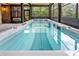 A large hot tub with clear blue water reflecting the screened in porch at 5705 Registry Oaks Se Ln, Mableton, GA 30126