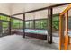Covered porch showcasing a large hot tub with stunning views of the surrounding landscape at 5705 Registry Oaks Se Ln, Mableton, GA 30126