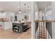 Stylish kitchen island with bar stools and pendant lights, seamlessly blending into the home's design at 5705 Registry Oaks Se Ln, Mableton, GA 30126