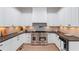Modern kitchen with white cabinetry, stainless steel appliances, and sleek countertops at 5705 Registry Oaks Se Ln, Mableton, GA 30126
