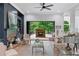 Elegant living room featuring a fireplace and doors leading to an outdoor patio at 5705 Registry Oaks Se Ln, Mableton, GA 30126