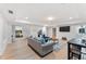 Relaxing living room features plush seating, a mounted television, and an open floor plan at 5705 Registry Oaks Se Ln, Mableton, GA 30126