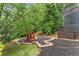 Backyard playground and mulch area next to home with access from wooden deck at 5705 Registry Oaks Se Ln, Mableton, GA 30126