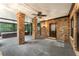 Indoor sun room with brick columns, a ceiling fan, and views of the outside makes for a relaxing atmosphere at 5705 Registry Oaks Se Ln, Mableton, GA 30126