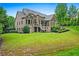 Expansive backyard featuring a screened porch, perfect for enjoying outdoor living and entertaining at 771 Tate Overlook, Marietta, GA 30064