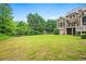 Expansive backyard with manicured lawn and mature trees for outdoor enjoyment at 771 Tate Overlook, Marietta, GA 30064