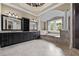 Spacious bathroom with double vanities, tile floor, and a soaking tub near the windows at 771 Tate Overlook, Marietta, GA 30064