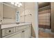 Bathroom with a light-colored vanity, ample storage, and a shower-tub combination at 771 Tate Overlook, Marietta, GA 30064