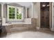 A view of the bathtub, shower, and window at 771 Tate Overlook, Marietta, GA 30064