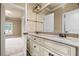 Bathroom featuring double sinks, a granite countertop, and ample lighting at 771 Tate Overlook, Marietta, GA 30064