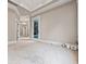 View of the empty bedroom with large windows, carpet, and white trim at 771 Tate Overlook, Marietta, GA 30064