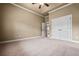 Spacious bedroom featuring plush carpet, a ceiling fan and ensuite bathroom access at 771 Tate Overlook, Marietta, GA 30064