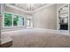 A carpeted bedroom with large windows and a view of the trees at 771 Tate Overlook, Marietta, GA 30064