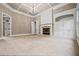 A carpeted bedroom with a fireplace and built-in cabinets at 771 Tate Overlook, Marietta, GA 30064