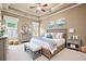 Charming bedroom with tray ceilings, neutral tones, soft carpet, and bright natural light at 771 Tate Overlook, Marietta, GA 30064