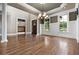 Formal dining room with hardwood floors, wainscoting, and elegant chandelier, perfect for entertaining guests at 771 Tate Overlook, Marietta, GA 30064
