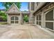 Spacious three-car garage with brick facade and carriage-style doors, providing ample parking and storage at 771 Tate Overlook, Marietta, GA 30064