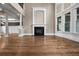 Open-concept living room with fireplace, hardwood floors, and abundant natural light at 771 Tate Overlook, Marietta, GA 30064