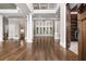 Elegant living room with hardwood floors, columns, and large windows, offering abundant natural light at 771 Tate Overlook, Marietta, GA 30064