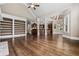 Open-concept living space with hardwood floors, built-in shelves, and ample natural light at 771 Tate Overlook, Marietta, GA 30064