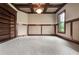 Cozy office with coffered ceilings, built-in bookshelves, and plush carpet, ideal for working from home at 771 Tate Overlook, Marietta, GA 30064
