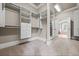 View of the carpeted walk-in closet with custom shelving and storage at 771 Tate Overlook, Marietta, GA 30064