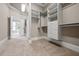 View of the carpeted walk-in closet with custom shelving and storage at 771 Tate Overlook, Marietta, GA 30064