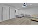 Bright bedroom with modern flooring, a fan, and a closet at 1701 English Ivey Nw Ln, Kennesaw, GA 30144