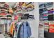 Walk-in closet with wire shelving and clothing racks; storage space with packed items and boxes at 1701 English Ivey Nw Ln, Kennesaw, GA 30144
