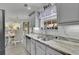 Bright kitchen with white cabinets, stainless steel appliances, and an eat-in dining area at 1701 English Ivey Nw Ln, Kennesaw, GA 30144